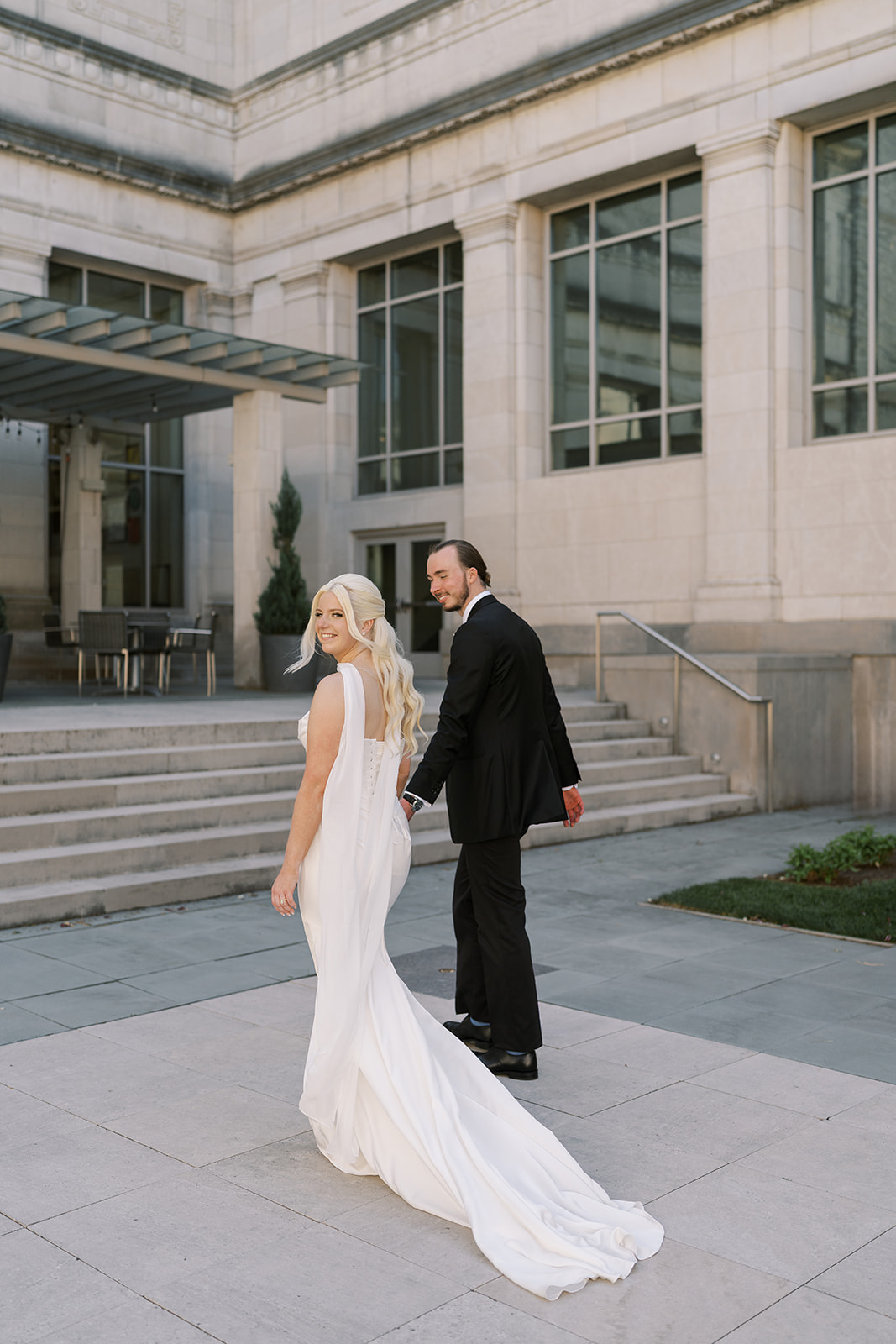 Niamh and Titus walking across the museum plaza
