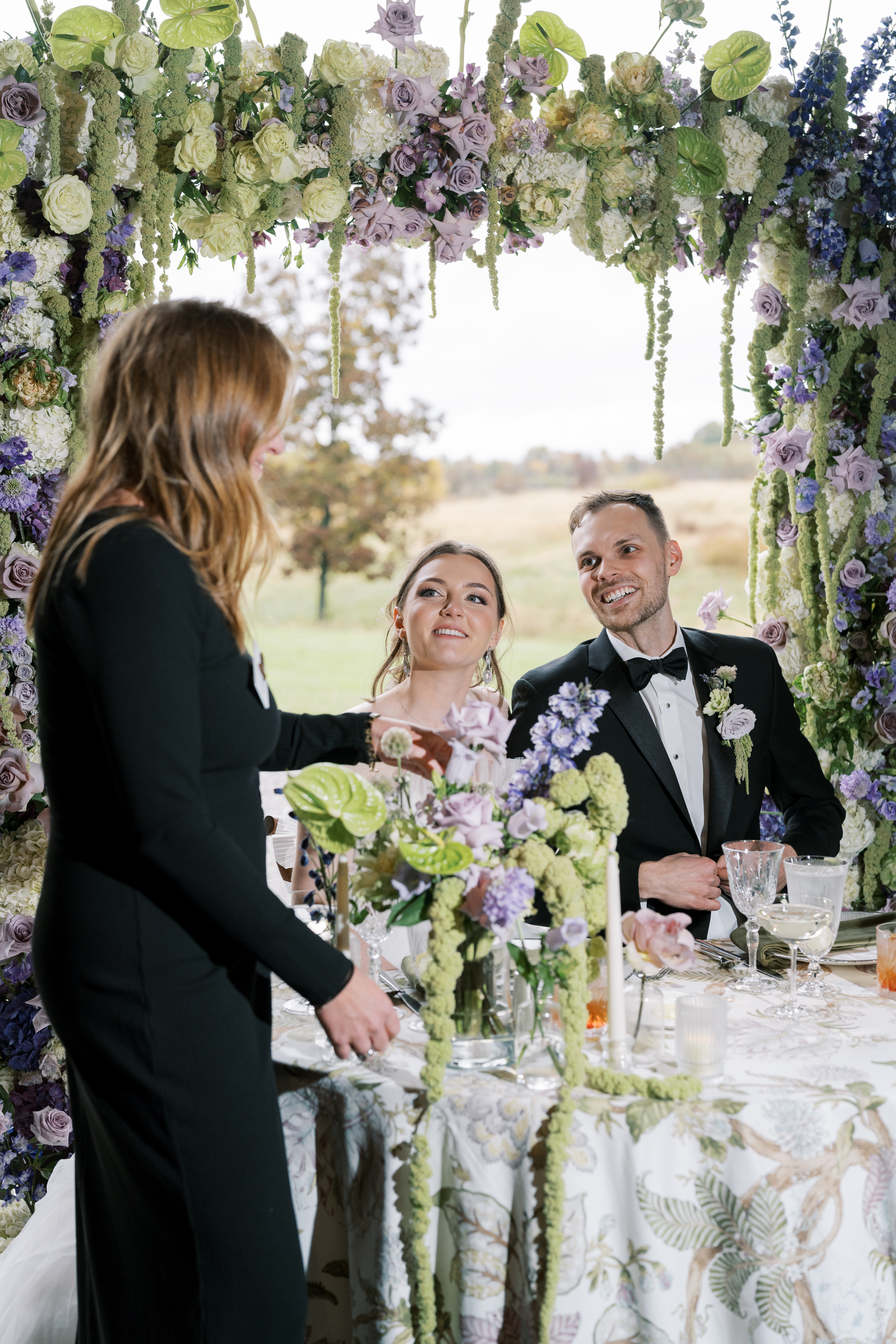 Leeann McKay speaking with the newlyweds during the wedding reception