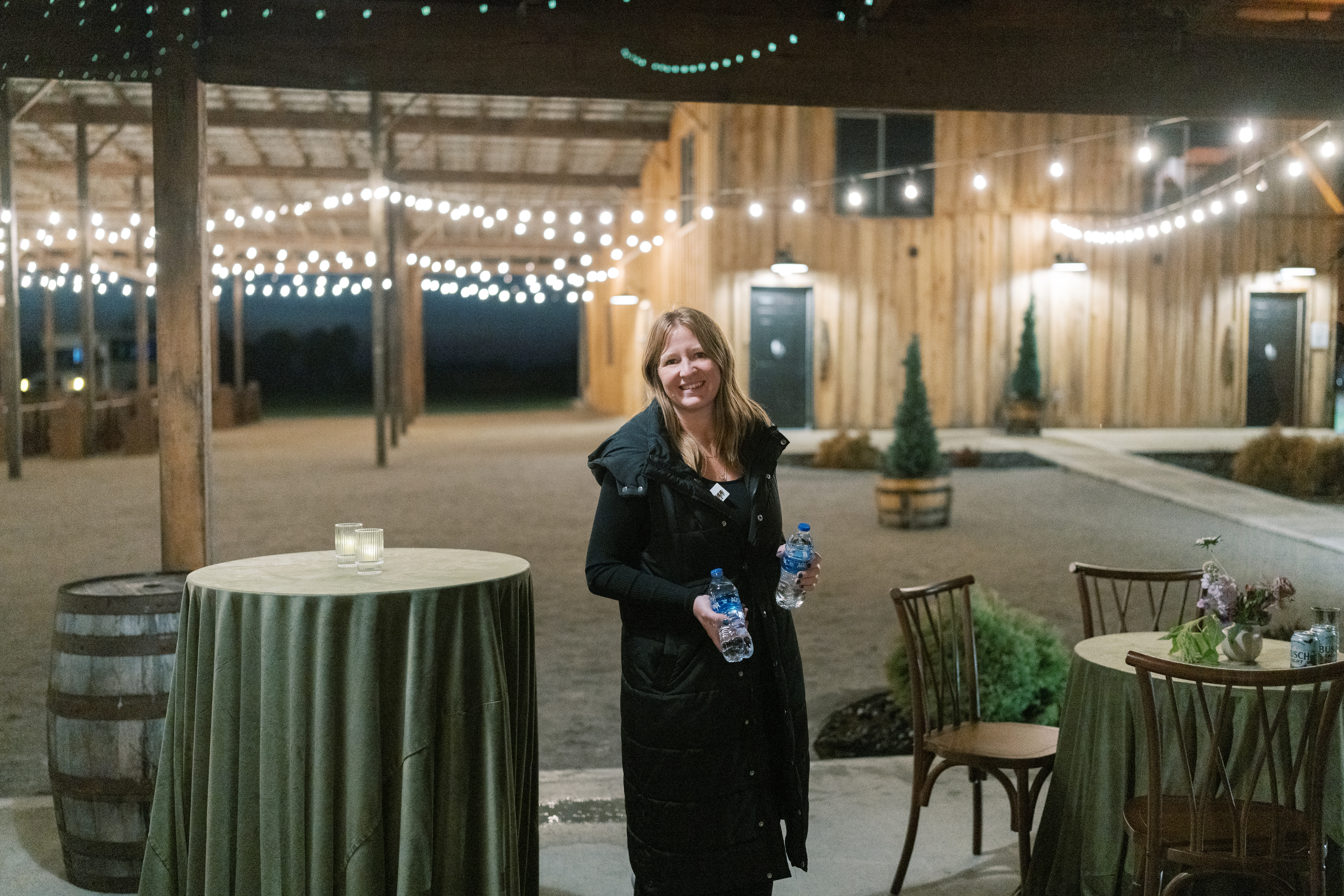 Leeann McKay standing in a candlelit wedding reception space during coordination