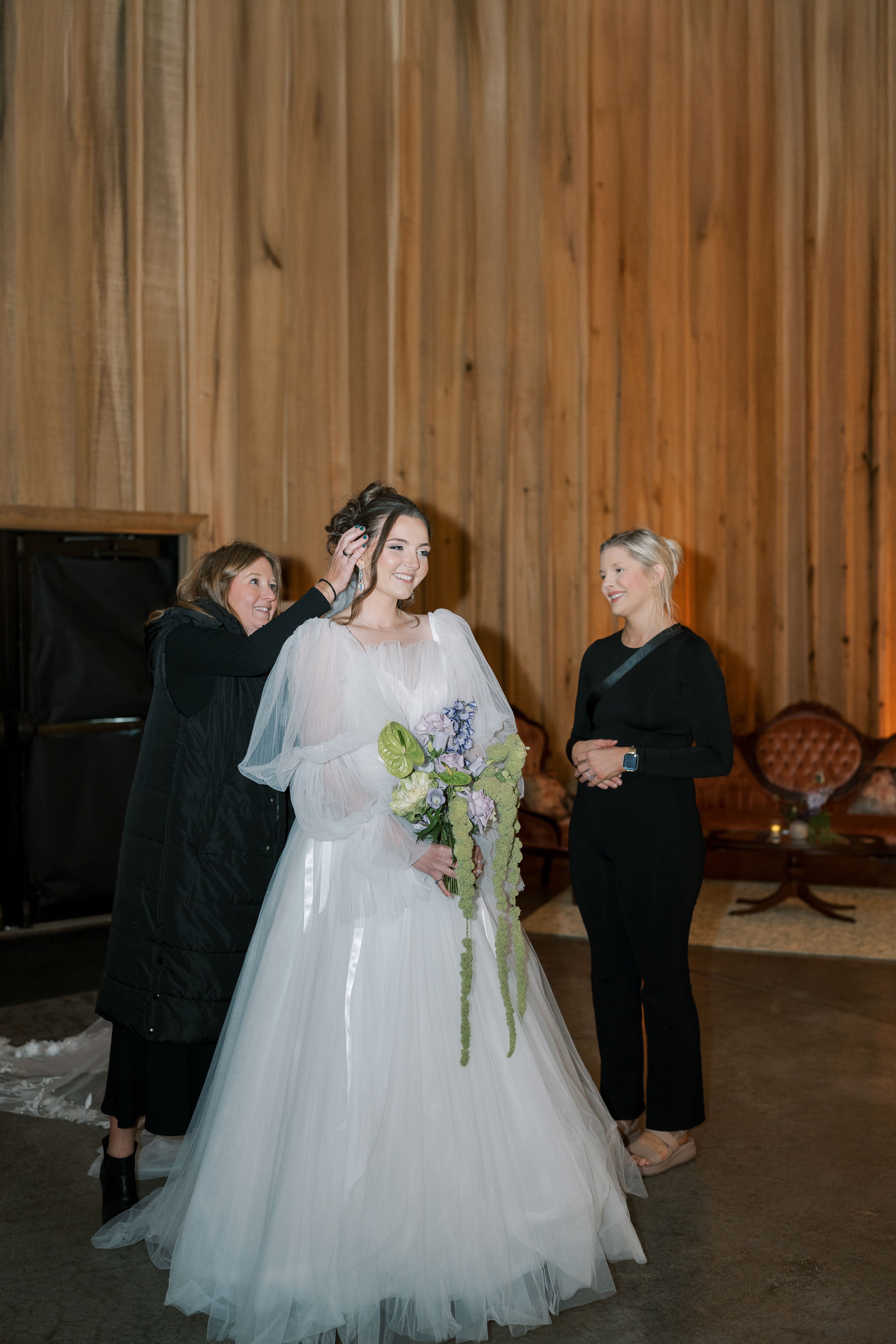 Leeann McKay walking with the bride during wedding-day coordination