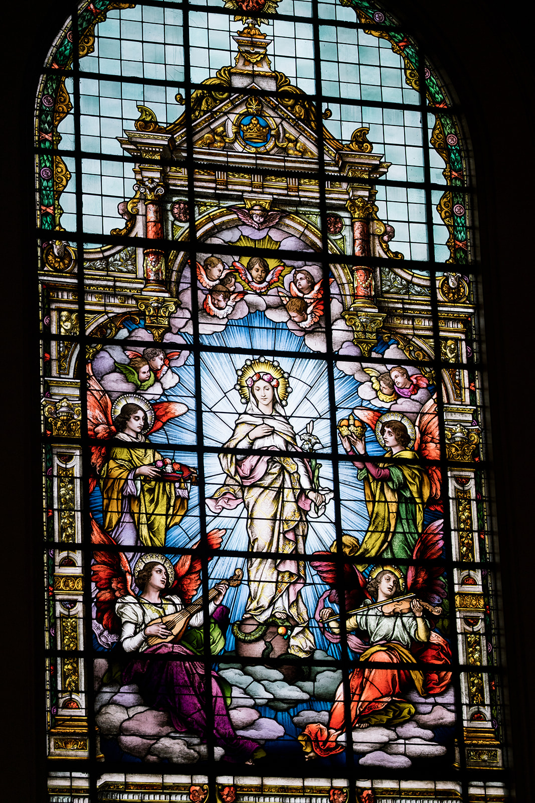 Colorful stained-glass window inside Mother of God Church