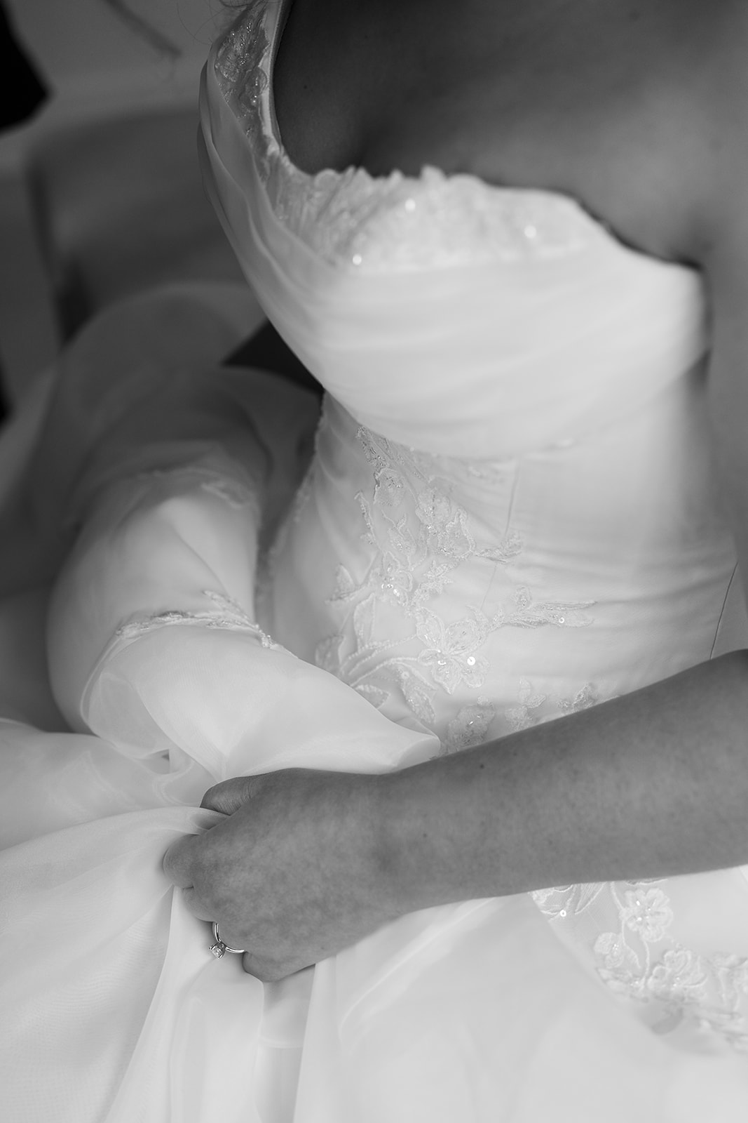 Close black-and-white detail of Hannalee's wedding gown