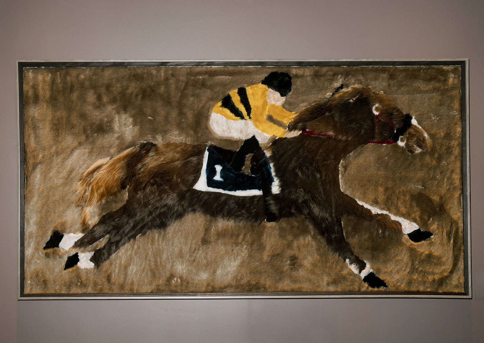 Horse-and-jockey artwork photographed during the wedding-day preparations