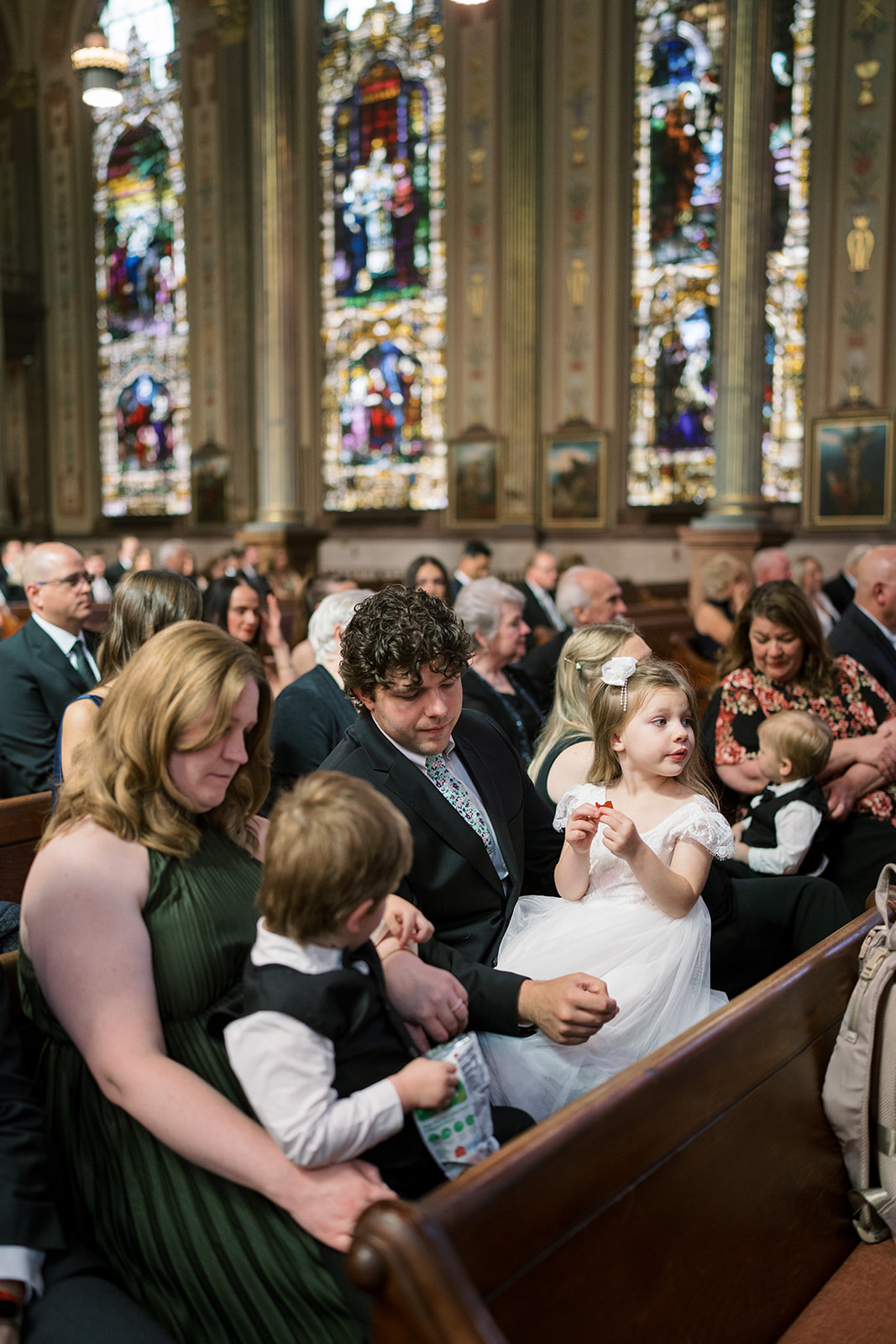 Family members seated together during the ceremony at Mother of God Church