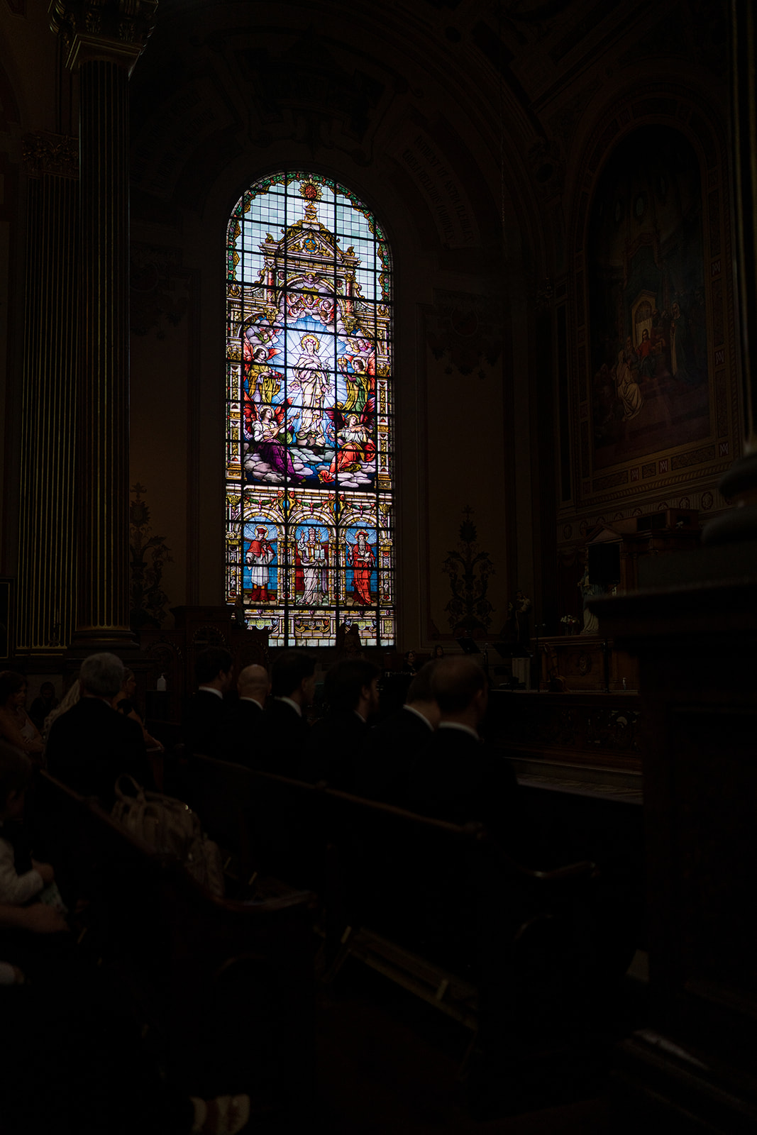 Moody view of stained glass inside Mother of God Church