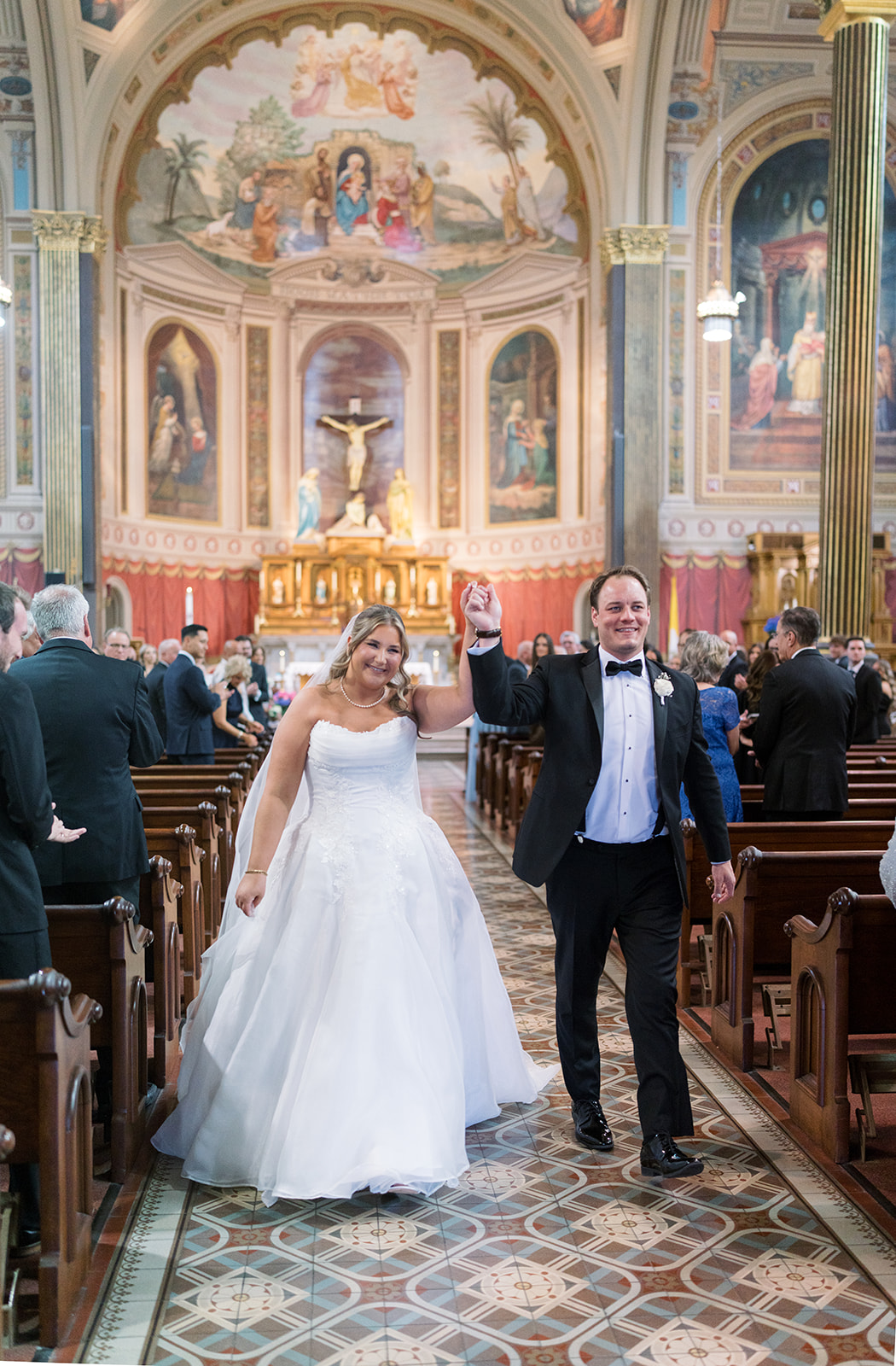 Ben and Hannalee walking back up the aisle together after their ceremony