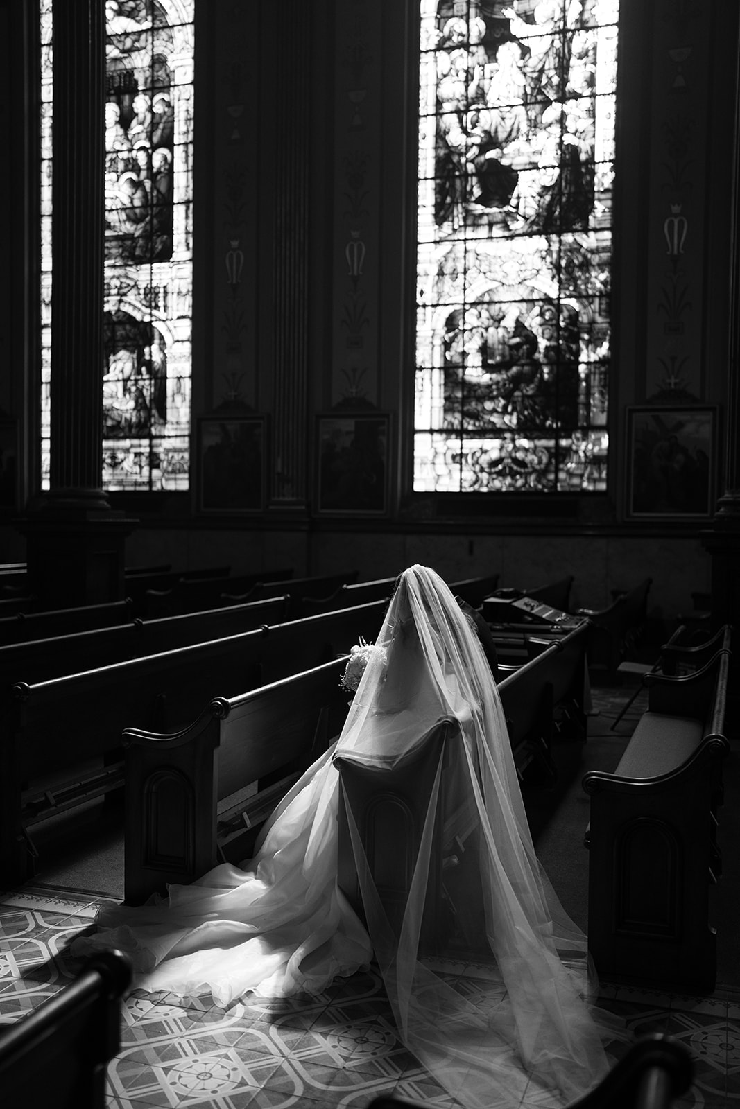Black-and-white profile portrait of Hannalee beneath her veil inside the church