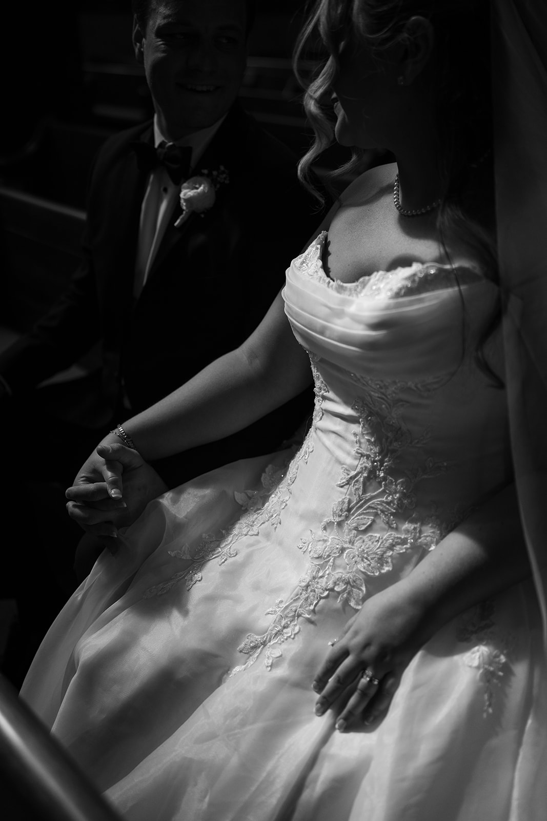 Dark black-and-white detail portrait of Hannalee's wedding gown
