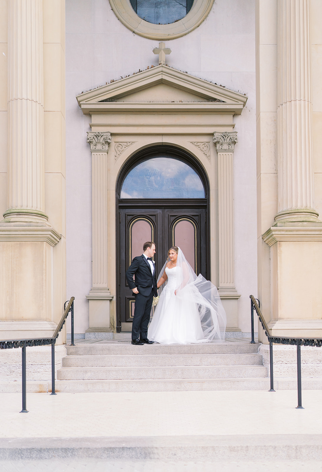 Ben and Hannalee standing together in the doorway of Mother of God Church