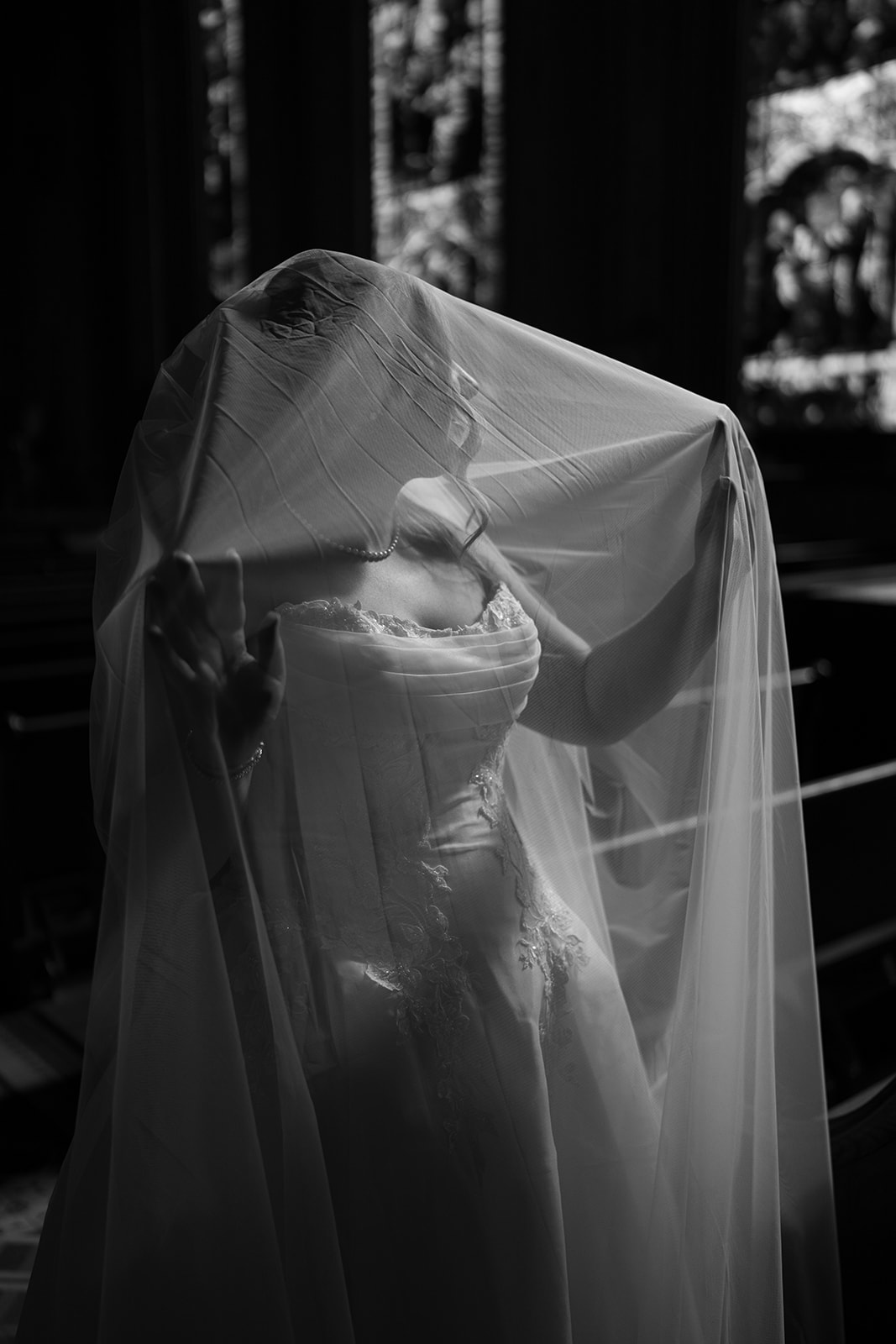 Black-and-white portrait of Hannalee beneath her veil