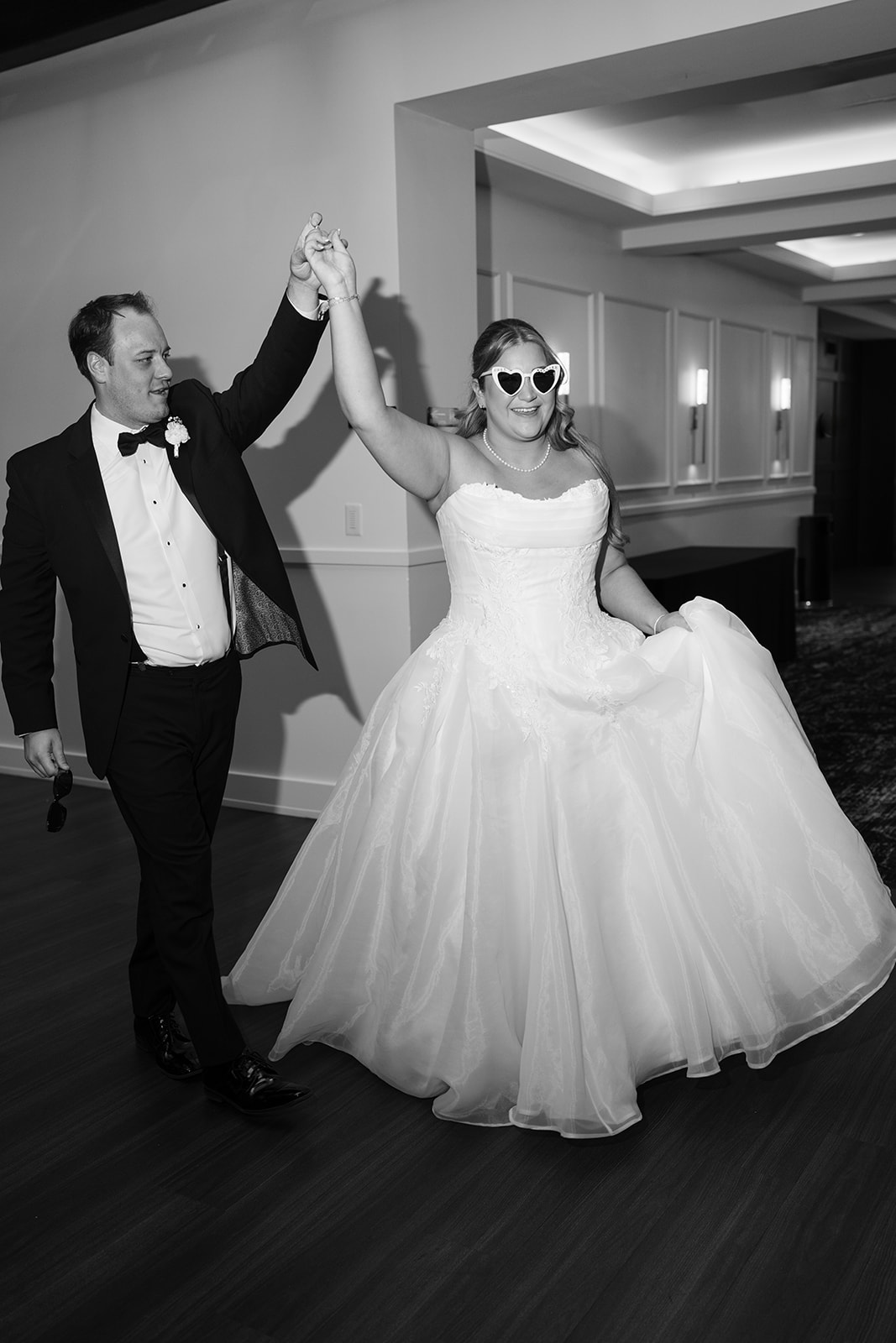 Black-and-white photograph of Ben and Hannalee dancing at their reception