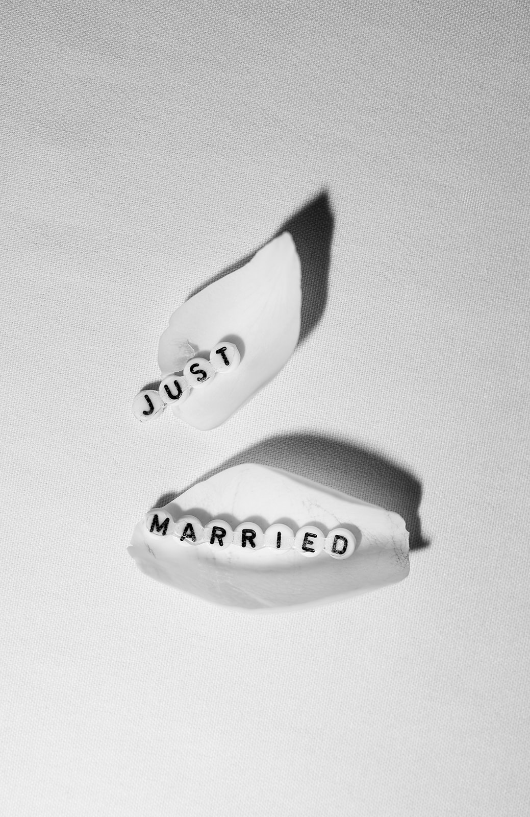 Just Married message written on the soles of wedding shoes