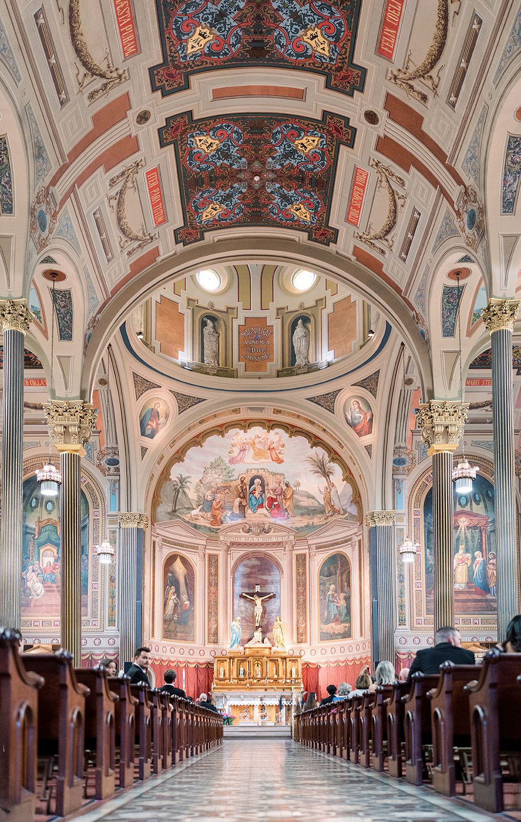 Wide center-aisle view of the ceremony inside Mother of God Church