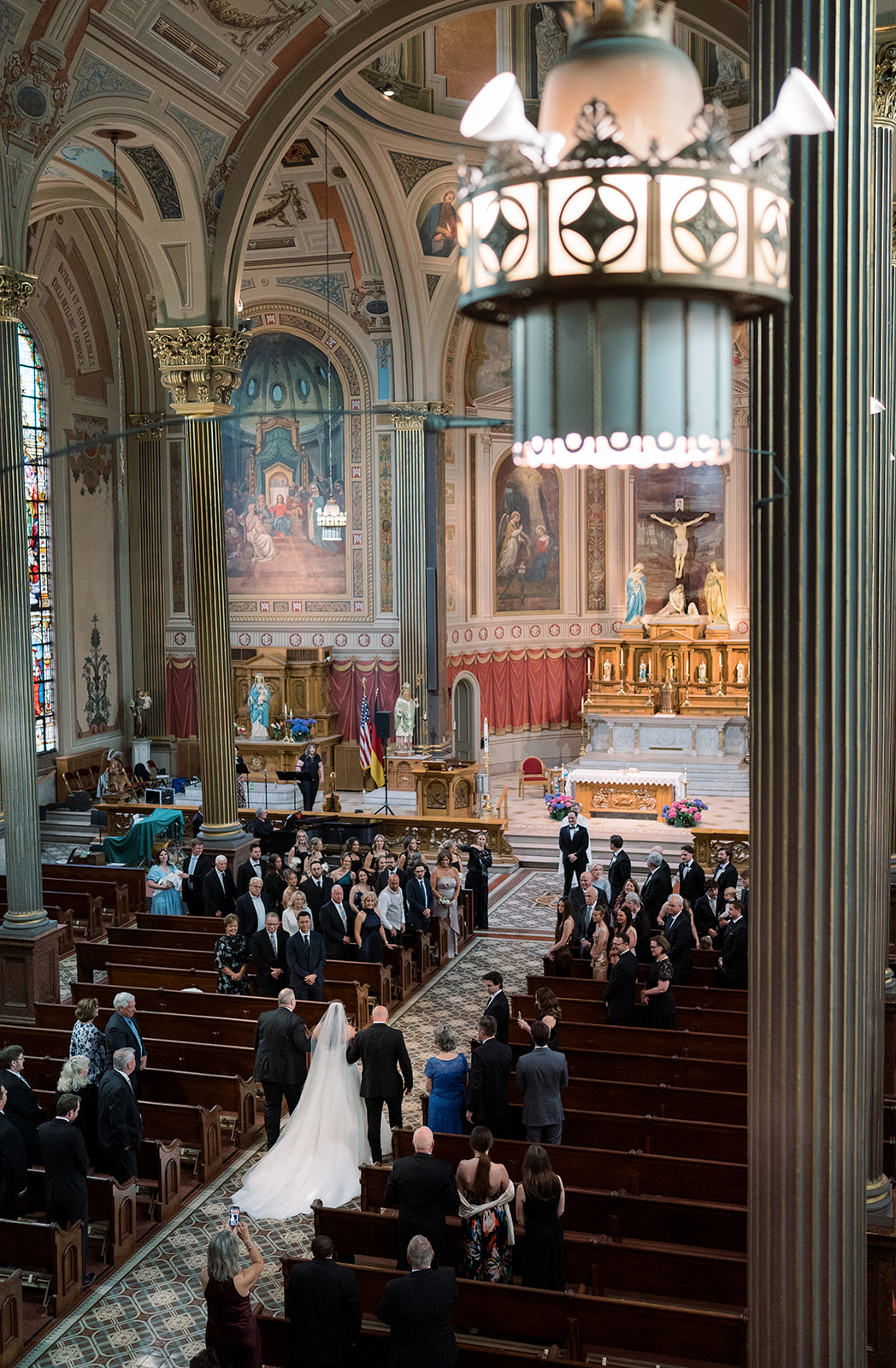 High-angle view of Hannalee moving through the church during the ceremony