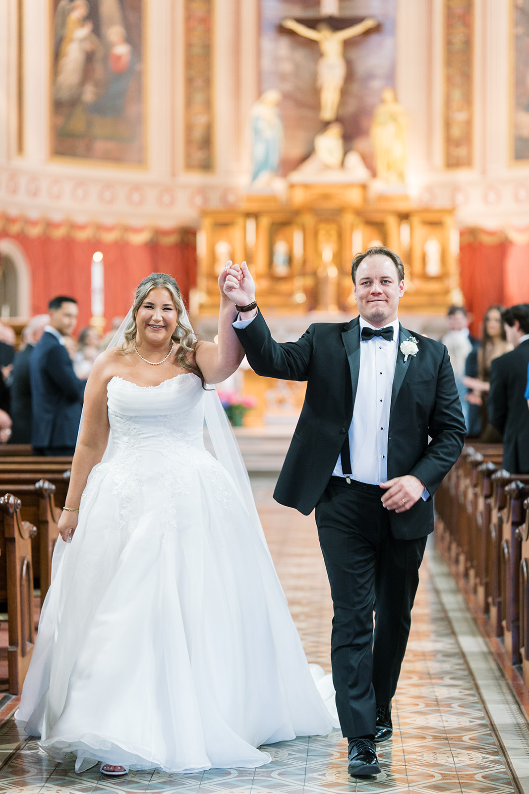 Ben and Hannalee walking up the aisle together after the ceremony