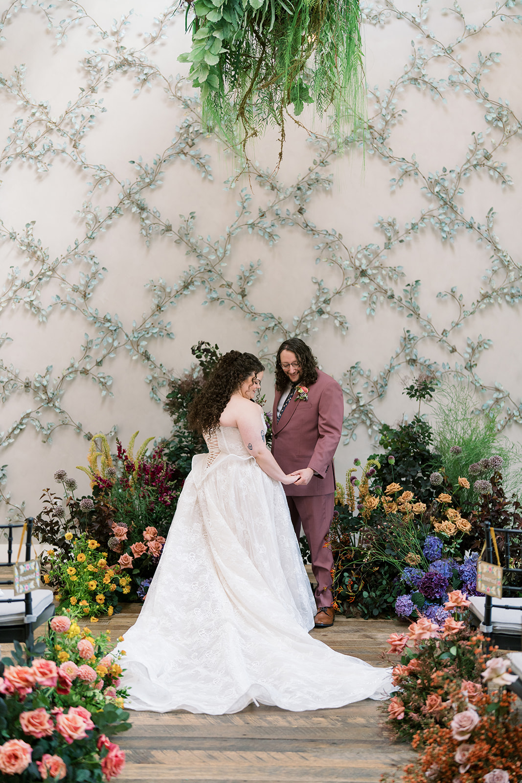 Jeff and Breanna together at the flower-lined ceremony setting at Terrain Gardens at DelVal