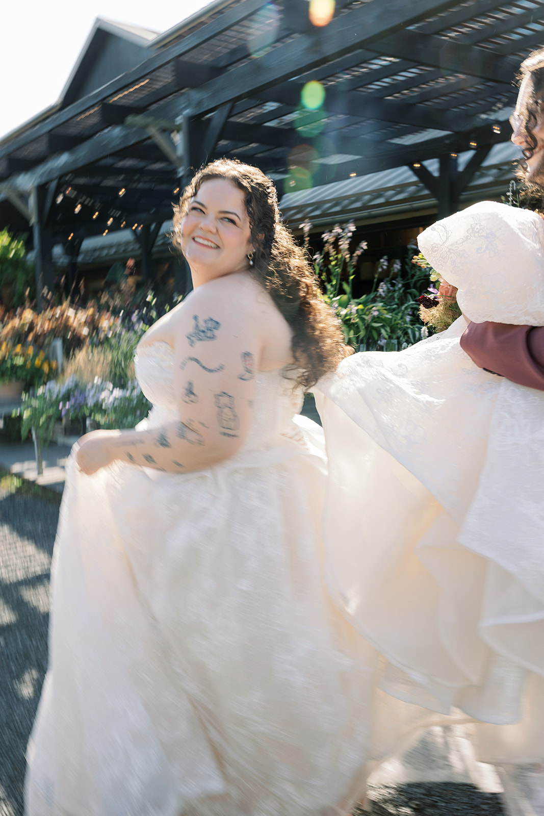 Bride outdoors in bright afternoon light at Terrain Gardens at DelVal