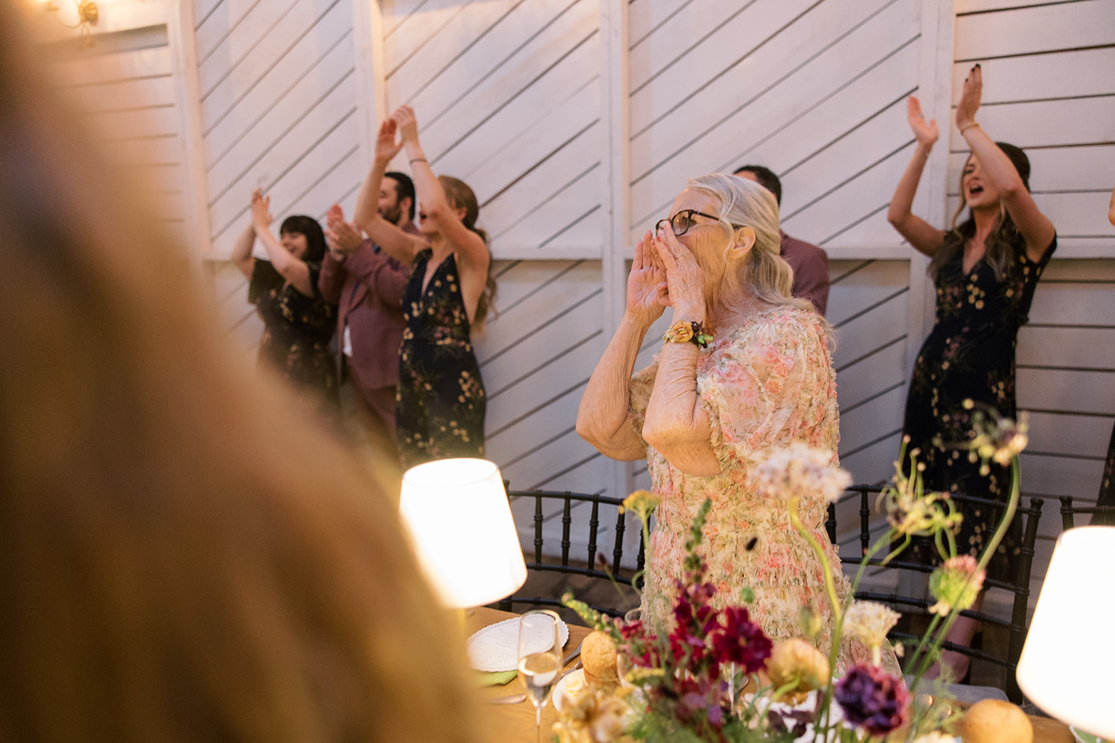 Guests celebrating around the reception tables