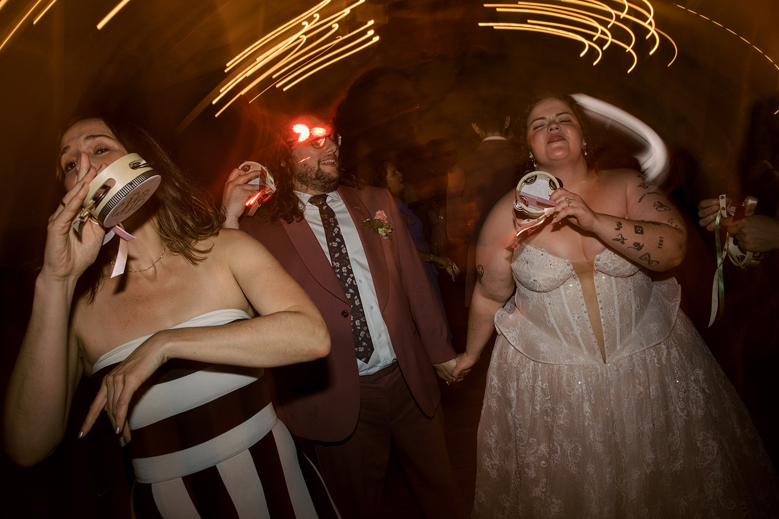 Wedding guests dancing during the evening celebration