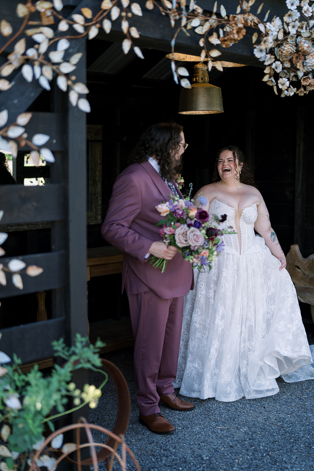 Jeff and Breanna together near a dark doorway at Terrain Gardens at DelVal