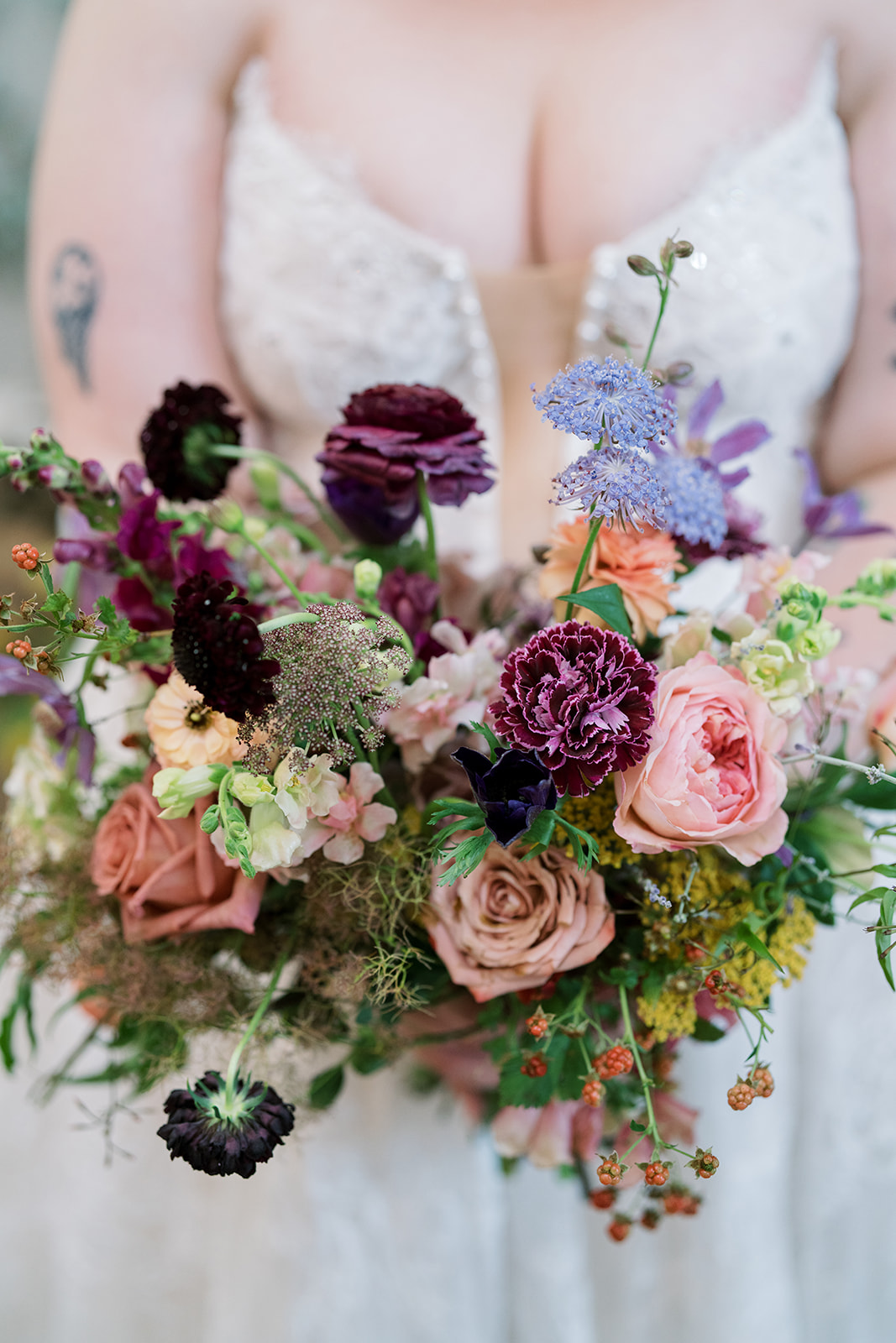 Close view of the bride's colorful garden-style bouquet