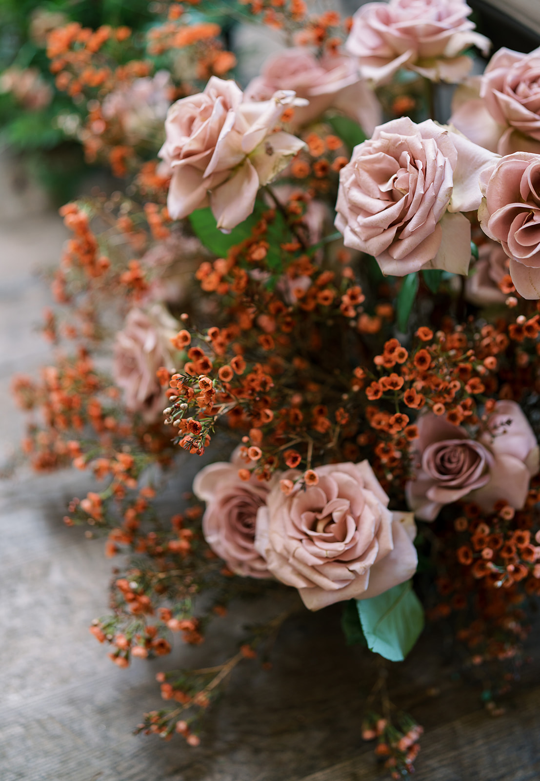 Close view of dusty-rose flowers in the reception design