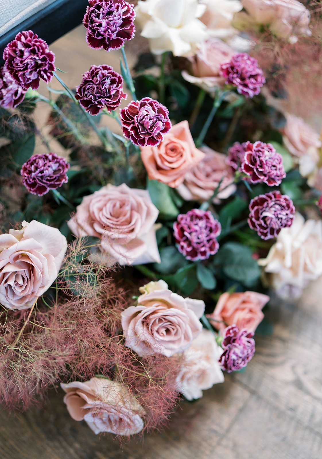 Layered pink and purple roses in Jeff and Breanna's floral design