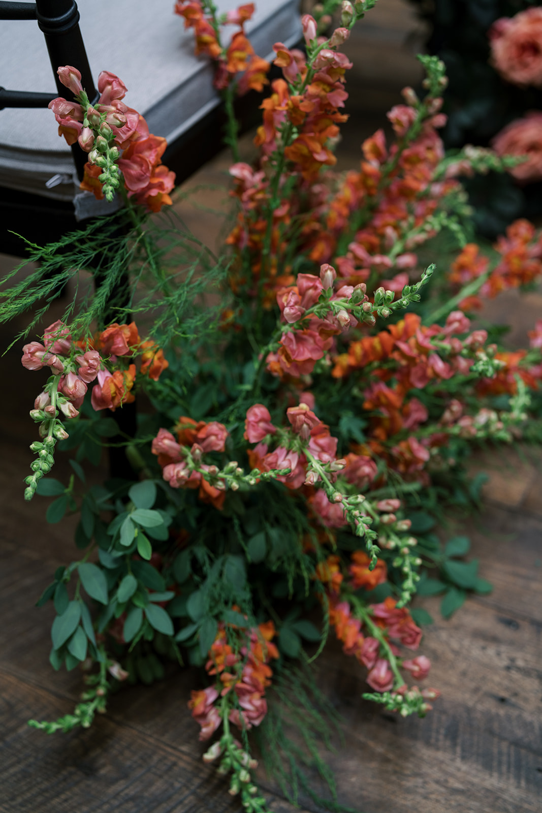 Orange-pink flowering branches in the garden-style arrangements