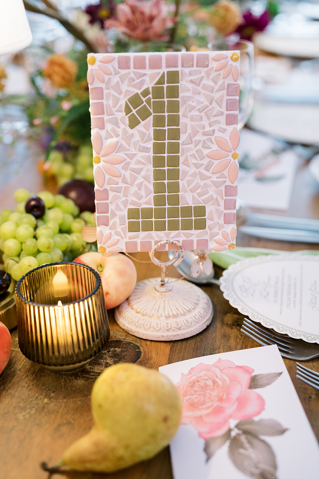 Table number one displayed with fruit, flowers and place settings