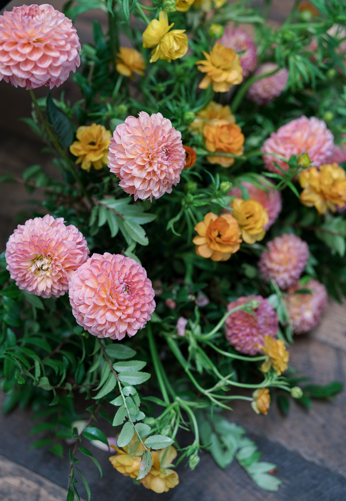 Pink and yellow flowers in the reception arrangements