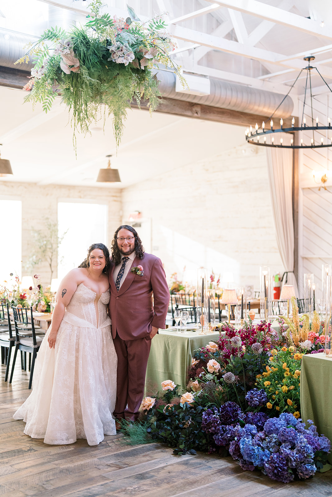 Jeff and Breanna together inside the flower-filled reception room