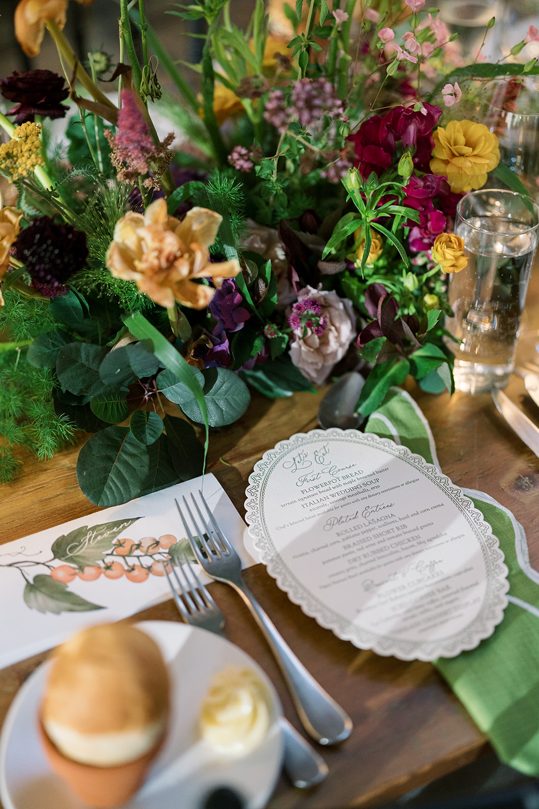 Menu and place setting beside colorful garden flowers