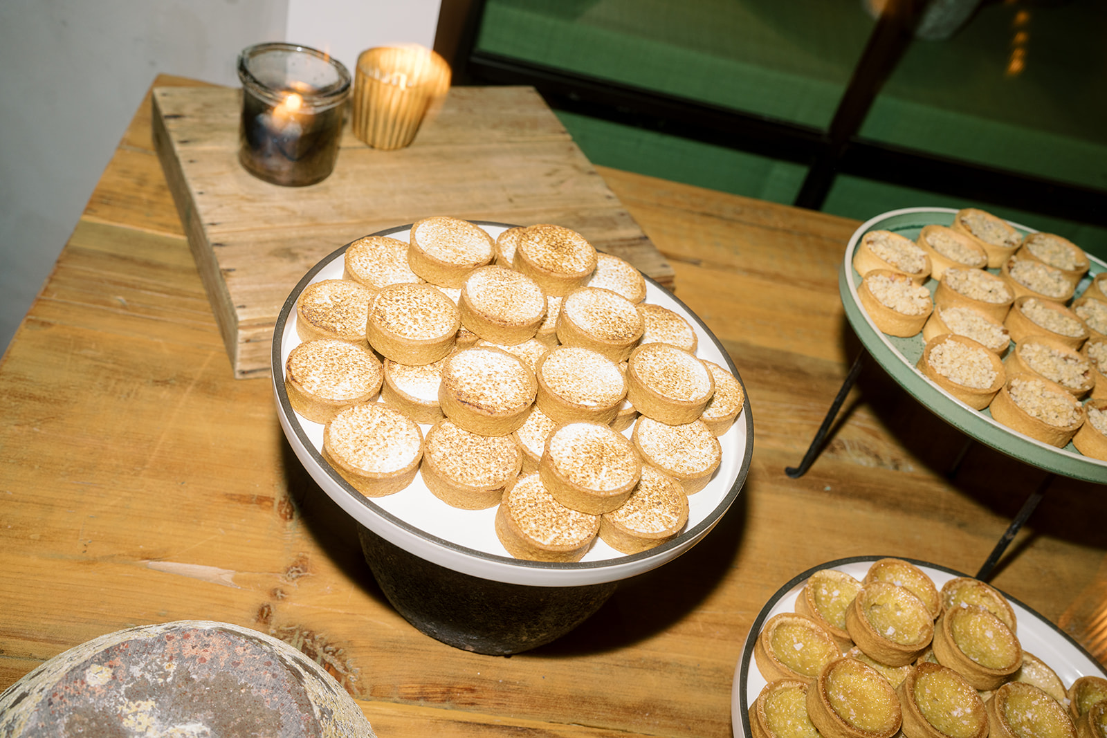 Assorted mini tart desserts on the wedding dessert table