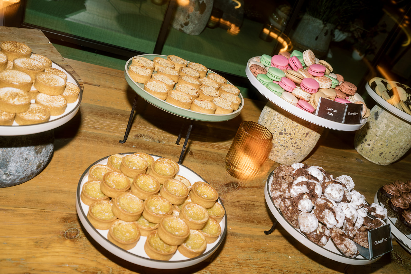 Wide display of assorted mini desserts and macarons