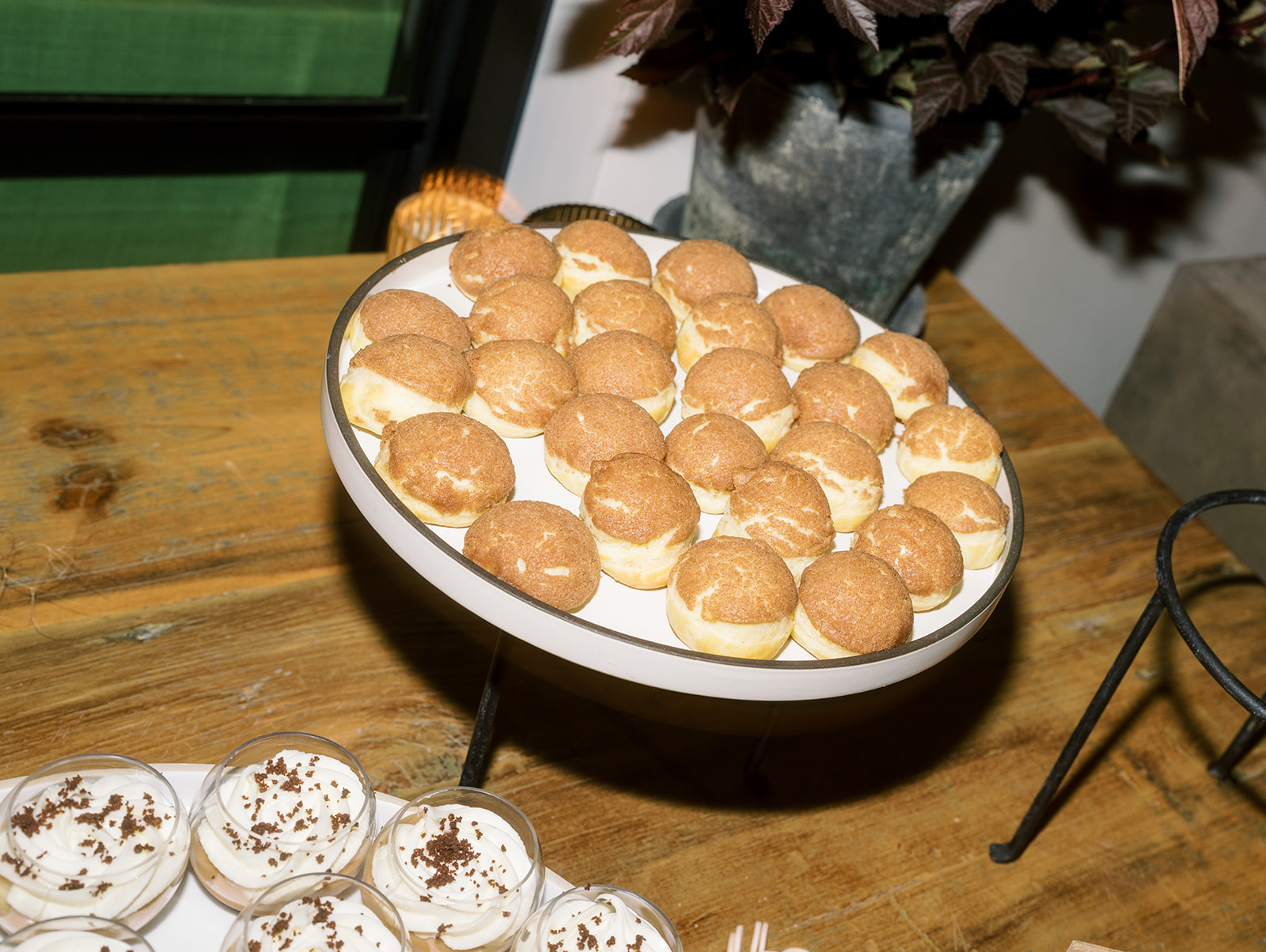 Mini cream-filled pastries on the dessert table