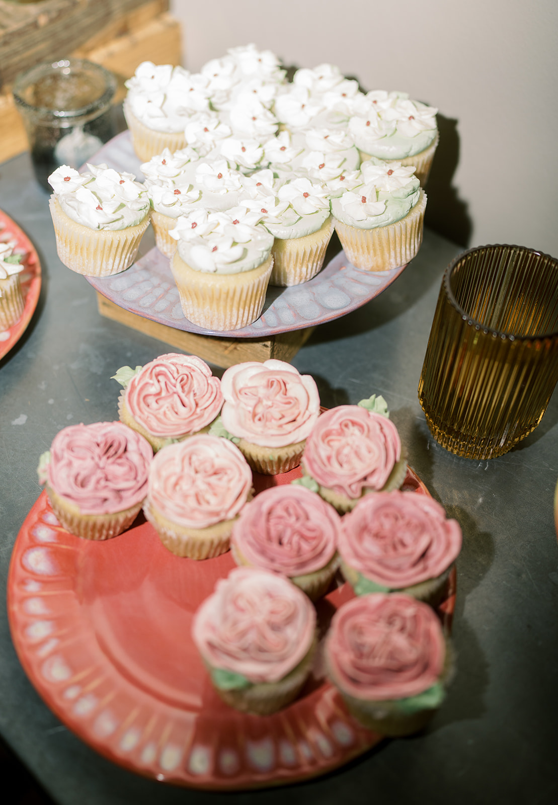 Pink and white cupcakes on a tiered dessert display