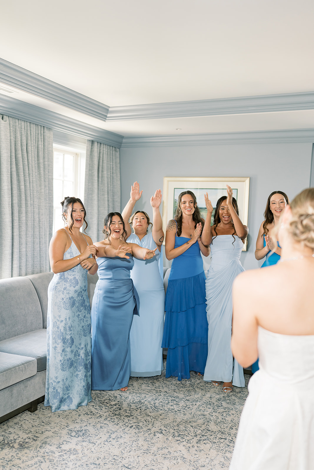 Caroline revealing her wedding dress to her bridesmaids