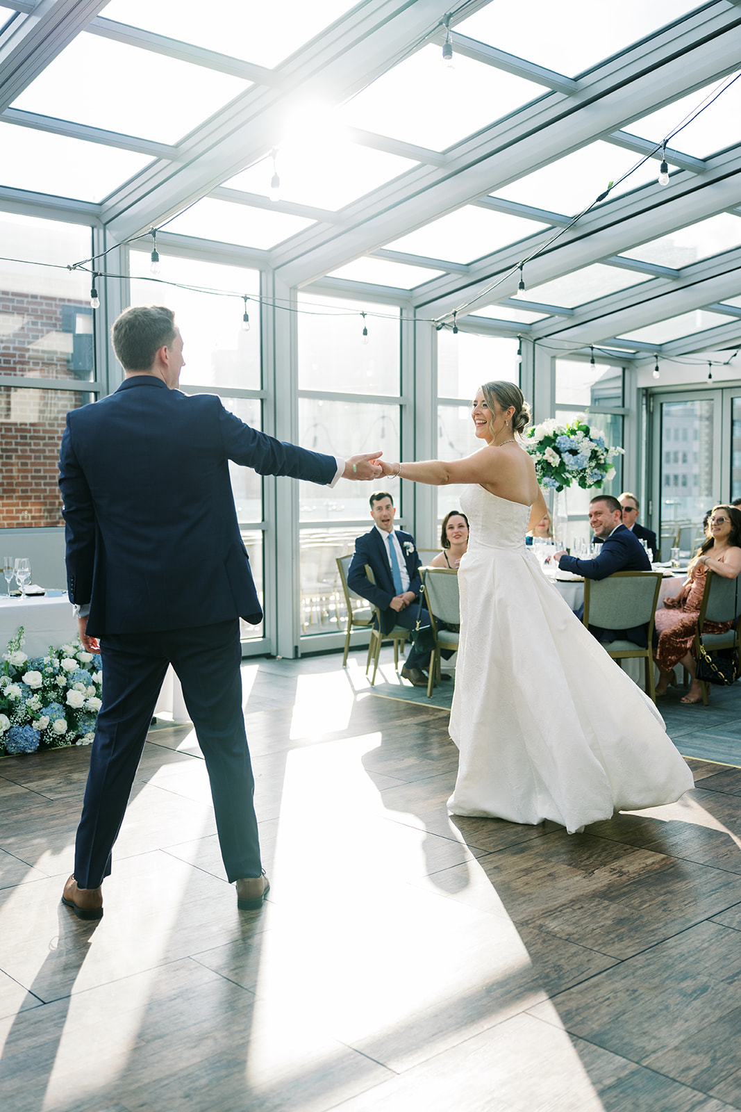Joey and Caroline dancing beneath the retractable glass roof at Vista at Lytle Park