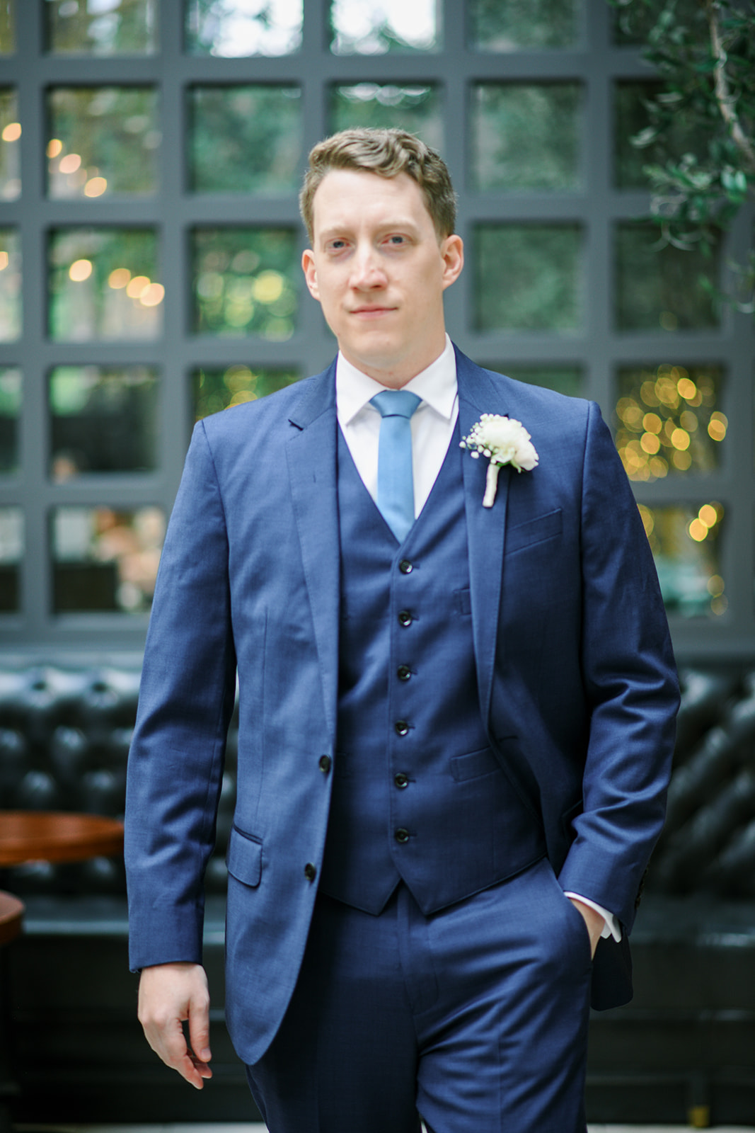 Joey in a navy suit at The Lytle Park Hotel before the wedding
