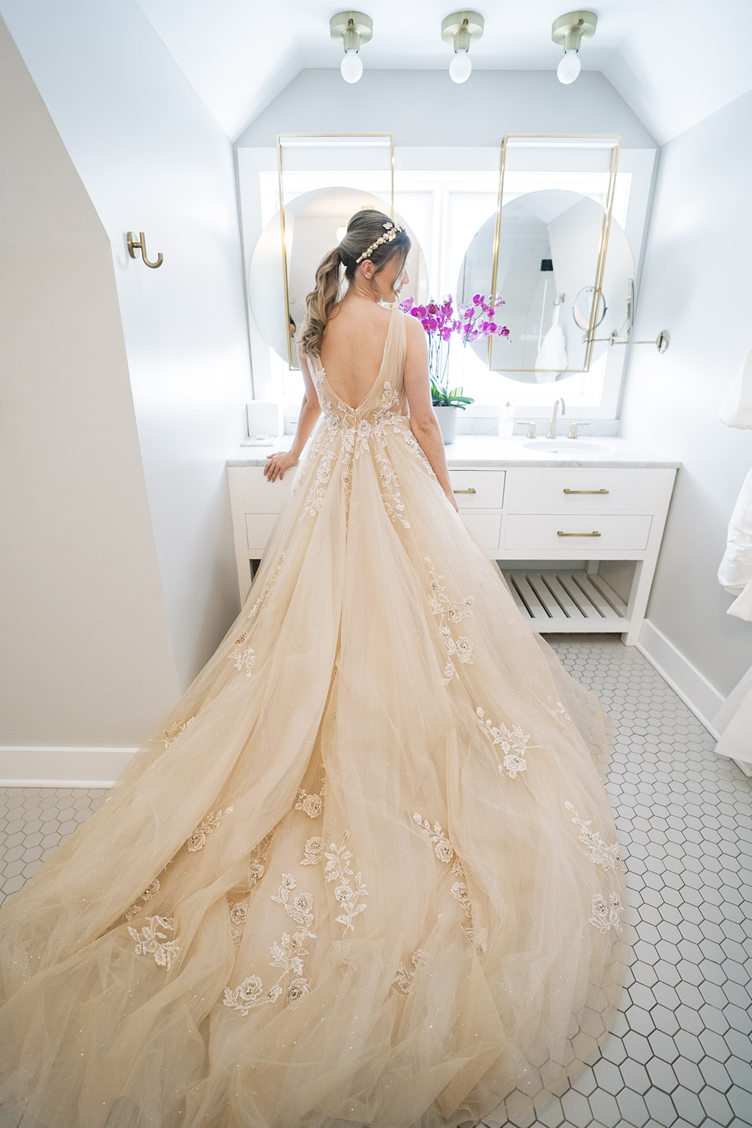 Courtney in her champagne wedding gown while getting ready