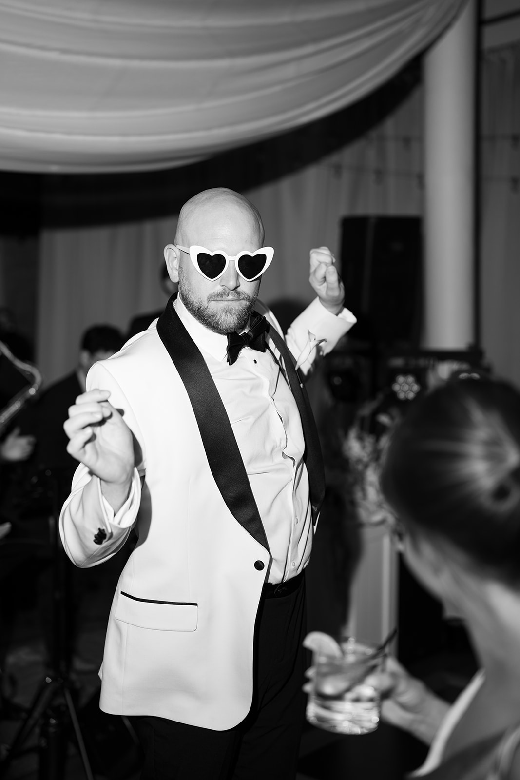 Kevin wearing sunglasses and dancing during the wedding reception