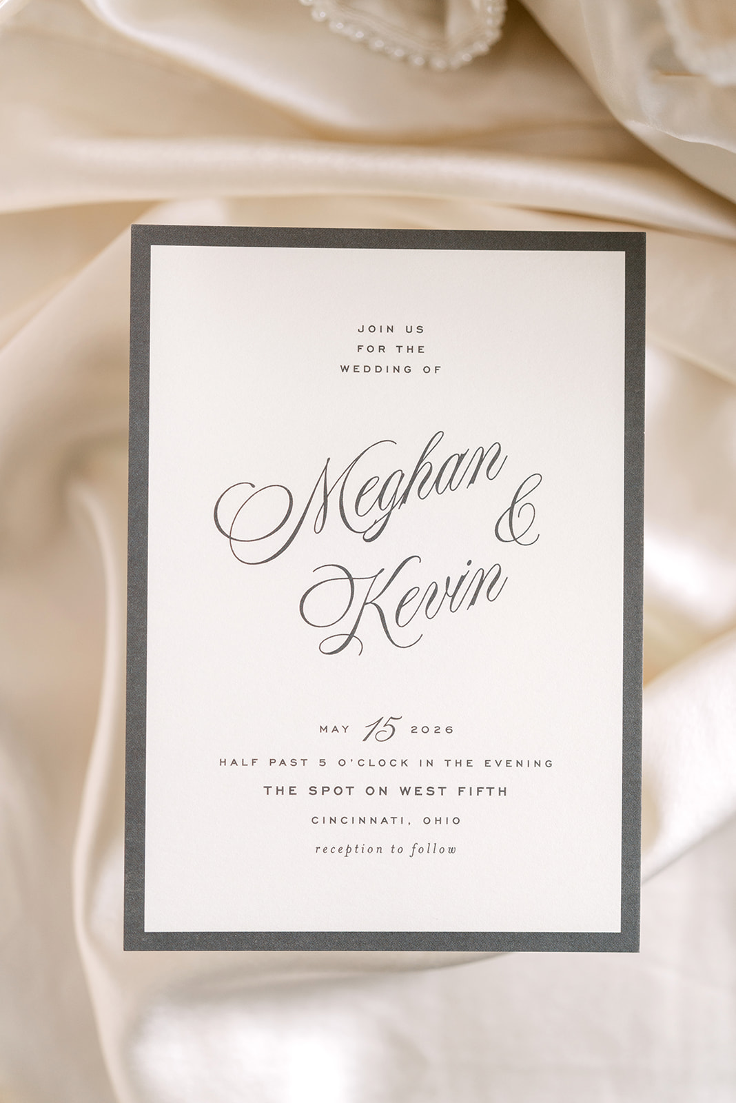Meghan and Kevin's wedding invitation for May 15, 2026 at The Spot on West Fifth in Cincinnati