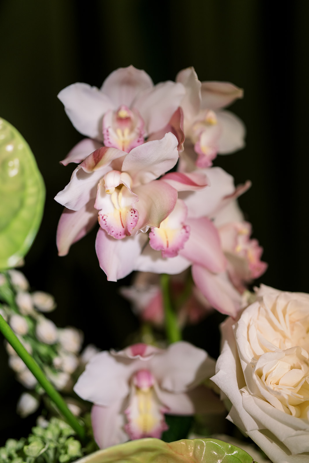 Close-up of pale pink orchids in the wedding floral design