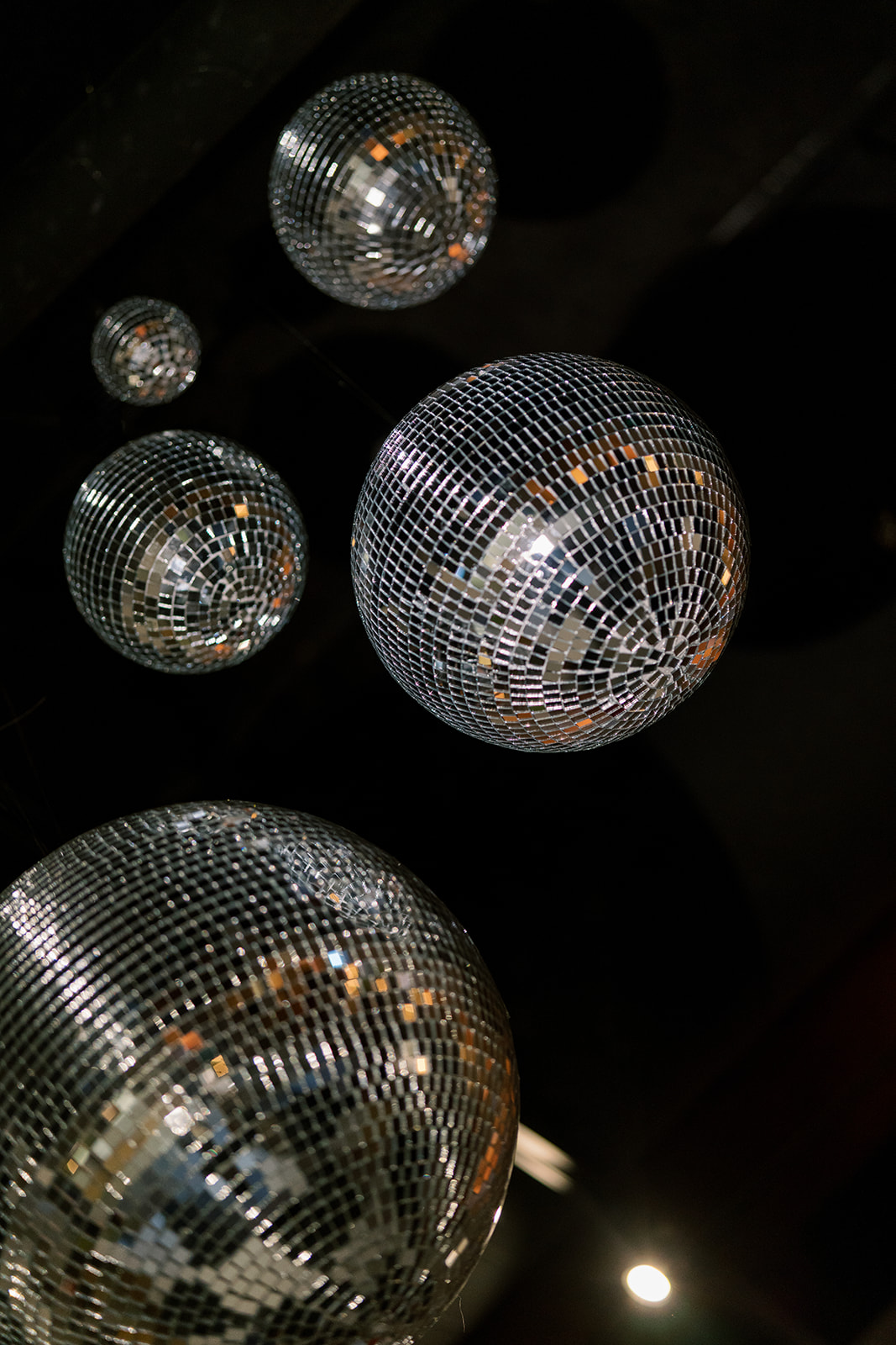Disco balls suspended above Meghan and Kevin's reception