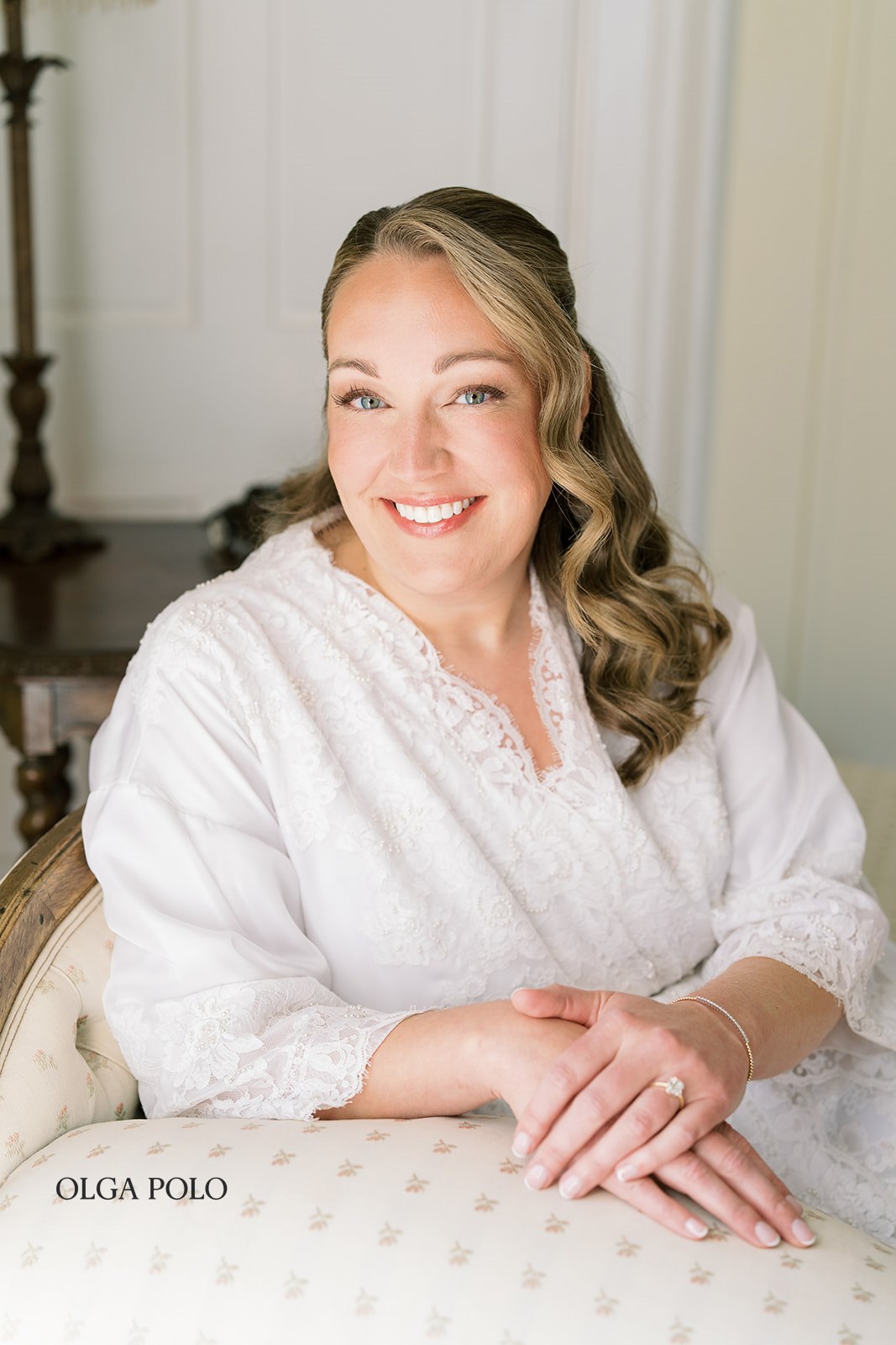 Beth smiling in a bright room at The Aldenberg Hotel before the ceremony