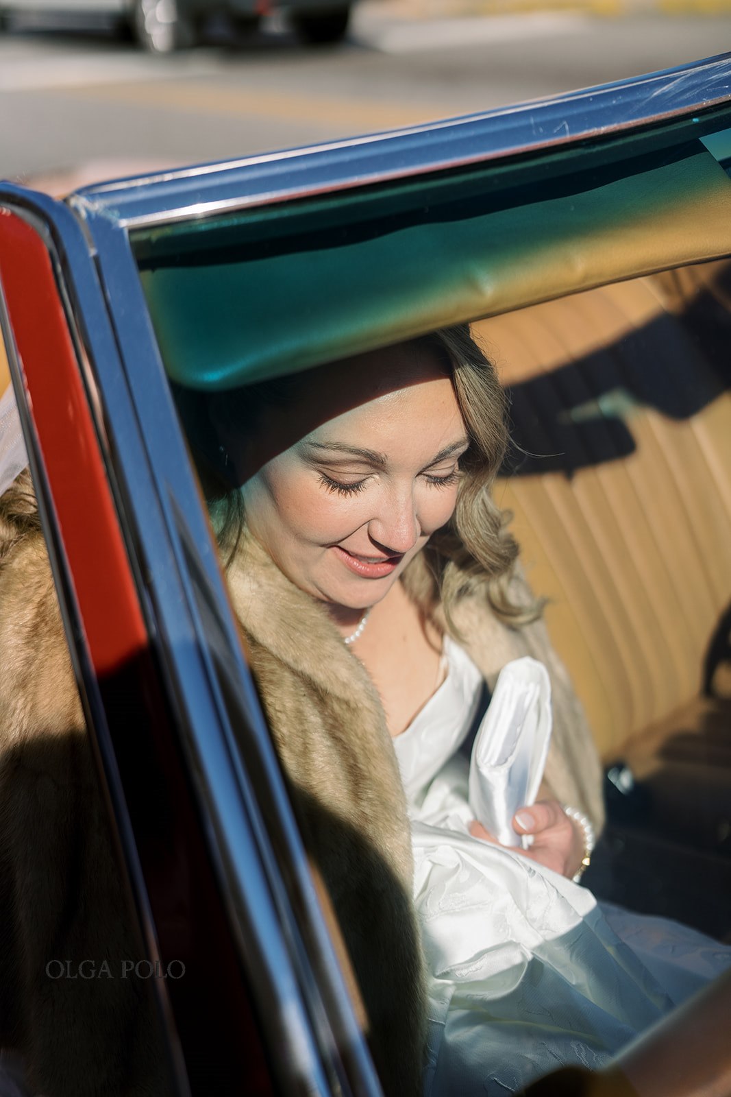 Beth arriving beside the vintage red Mercedes on her wedding day in Versailles