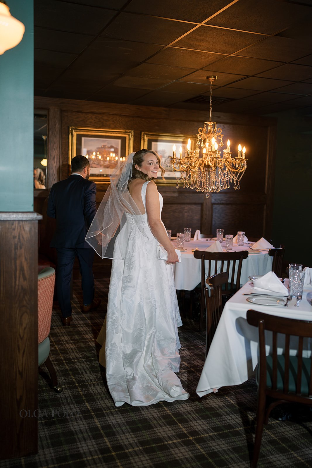 Ryan and Beth posing together in the dining room at The Aldenberg Hotel