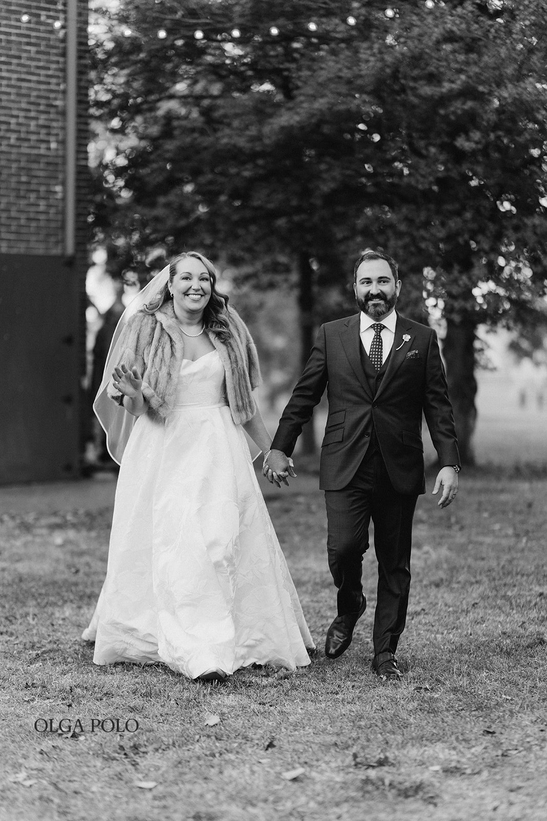 Ryan and Beth walking together outdoors as evening falls at Heartland of Versailles