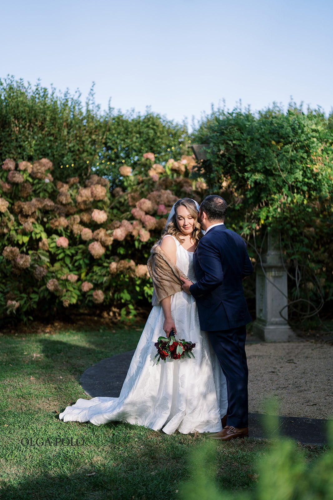 Ryan and Beth kissing in the garden at Heartland of Versailles