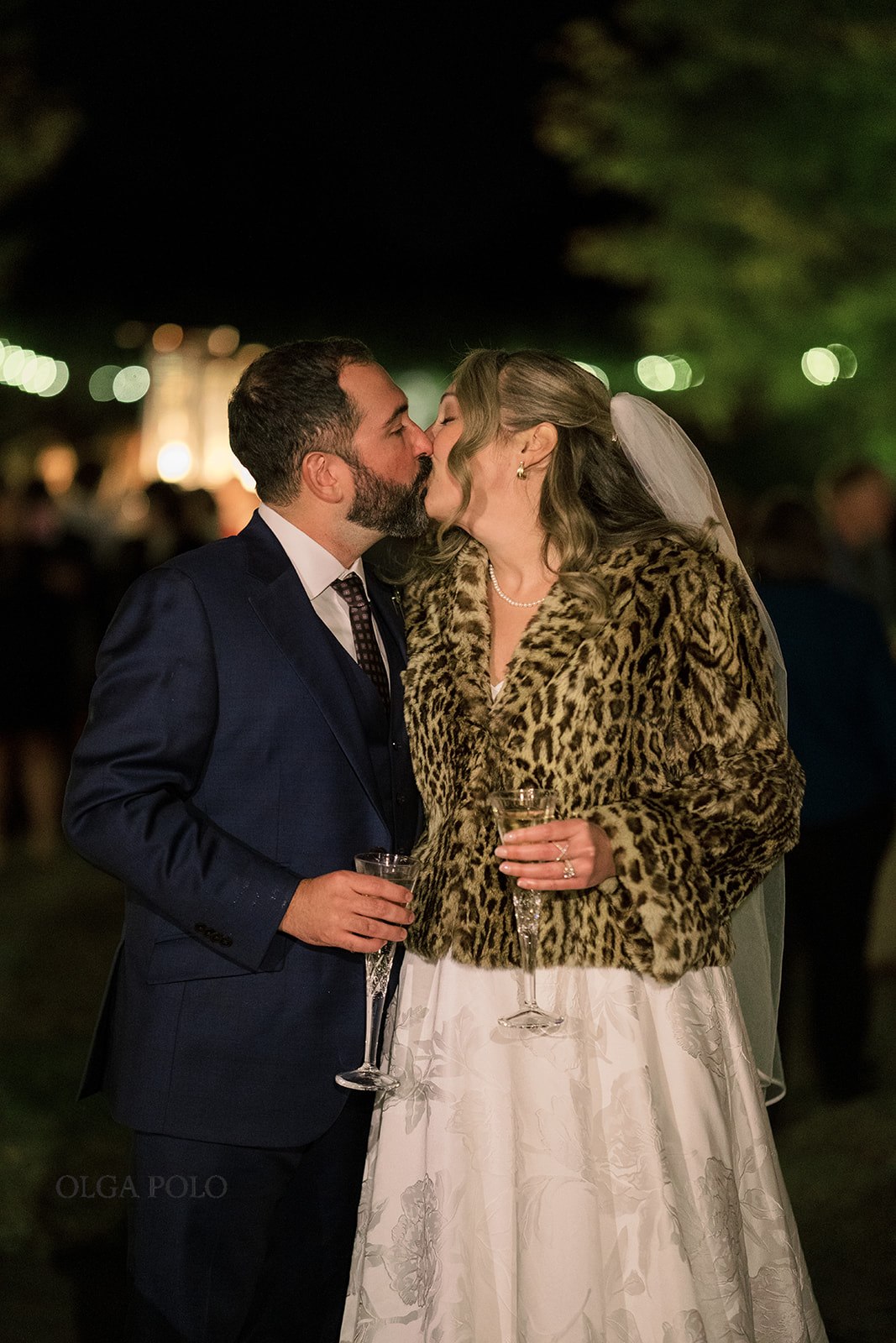 Ryan and Beth kissing at the end of their outdoor wedding celebration